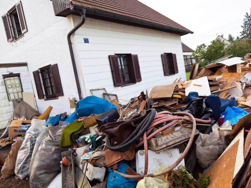 rubbish piled up outside house