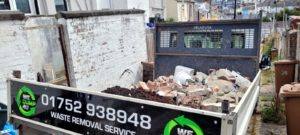 Back of wedump4u truck containing rubble waste