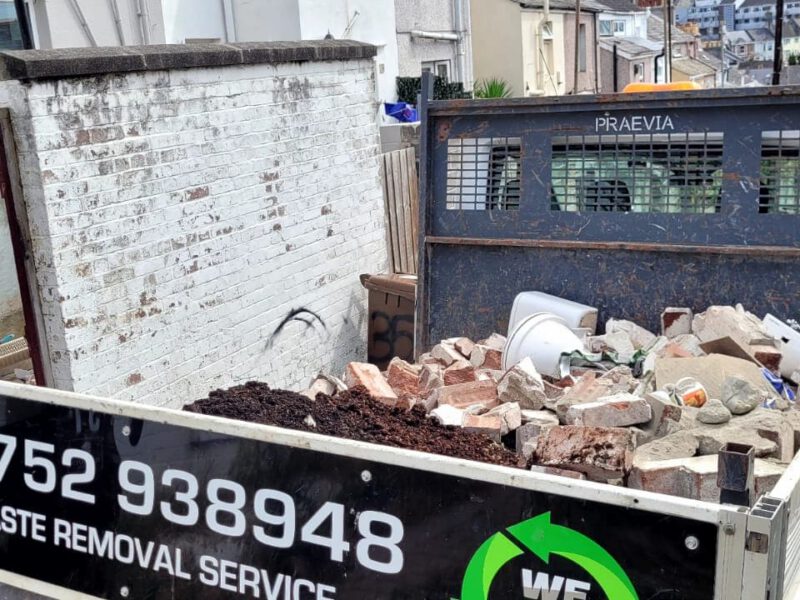 Back of wedump4u truck containing rubble waste