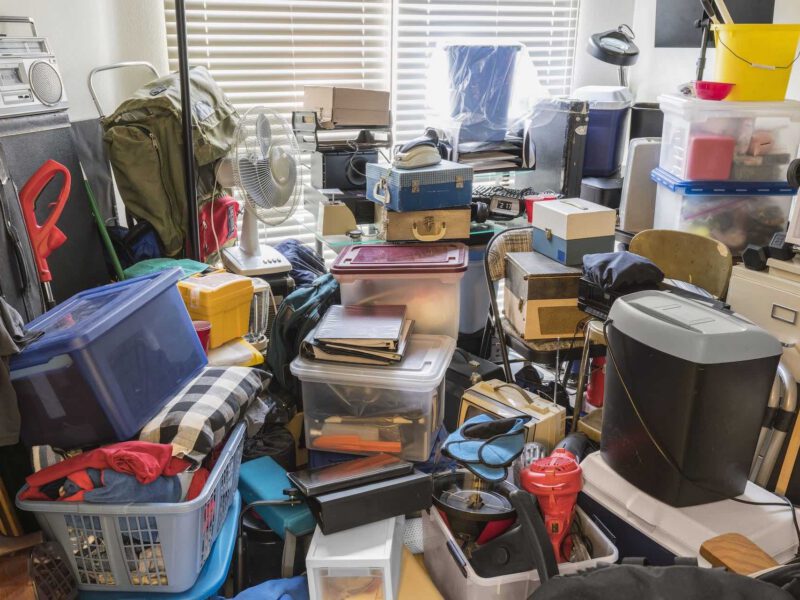 Image of waste in a house, full of boxes, old papers, magazines, clothes etc. needing house clearance services in Plymouth.